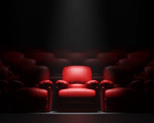 Red sofa Seat in front of black wall with spotight